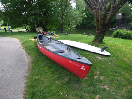 Canoe and standup paddle board for rent – sidewalk – soft surface by sidewalk